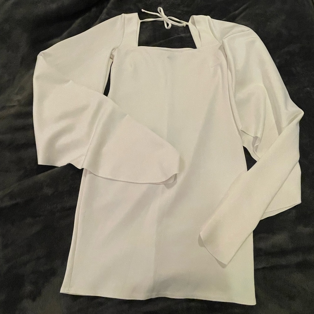 White fitted dress with bell sleeves